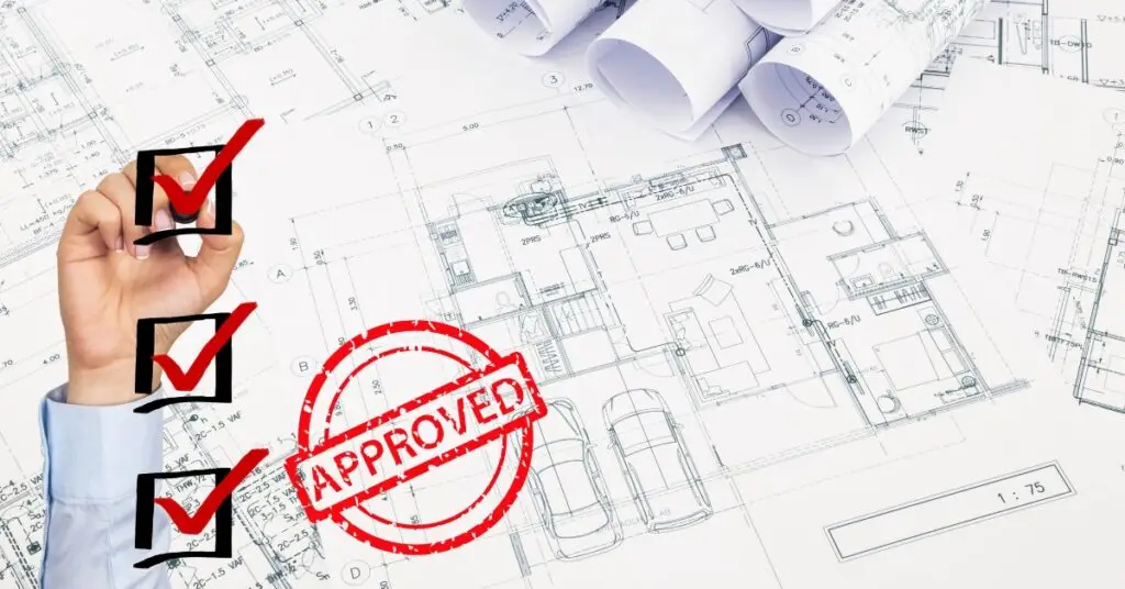 Architectural blueprint of a house with driveway featuring check marks and an 'APPROVED' stamp, symbolising successful planning permission.